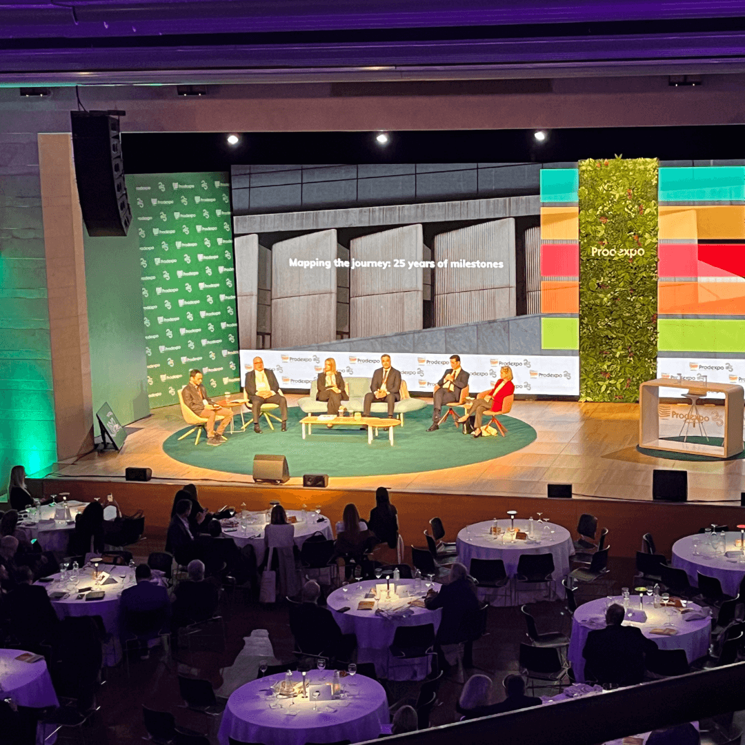Speaker panel on a stage for seated audience